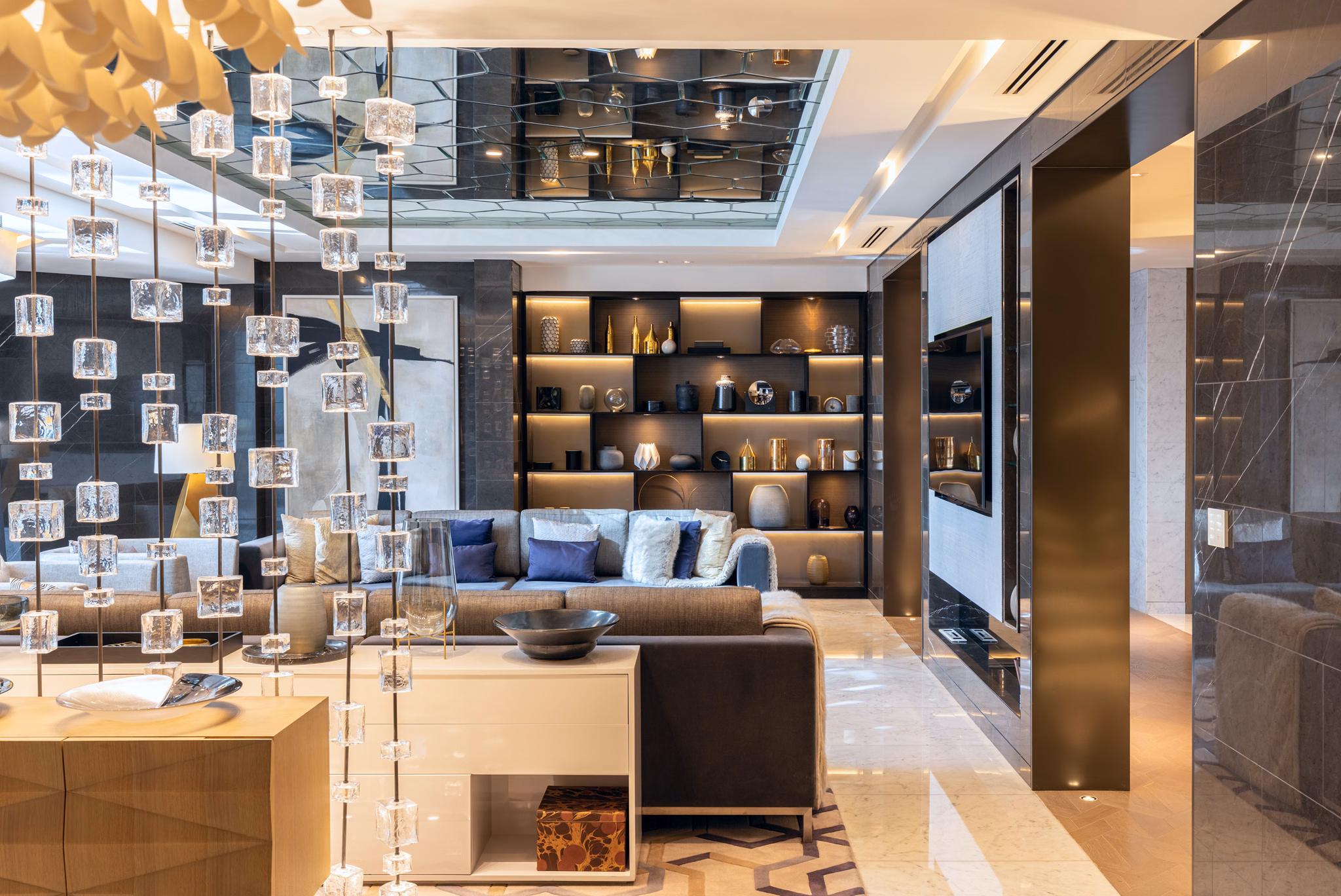 Suite living space with sliding timber panels at Al Bandar Rotana in Dubai Creek, UAE