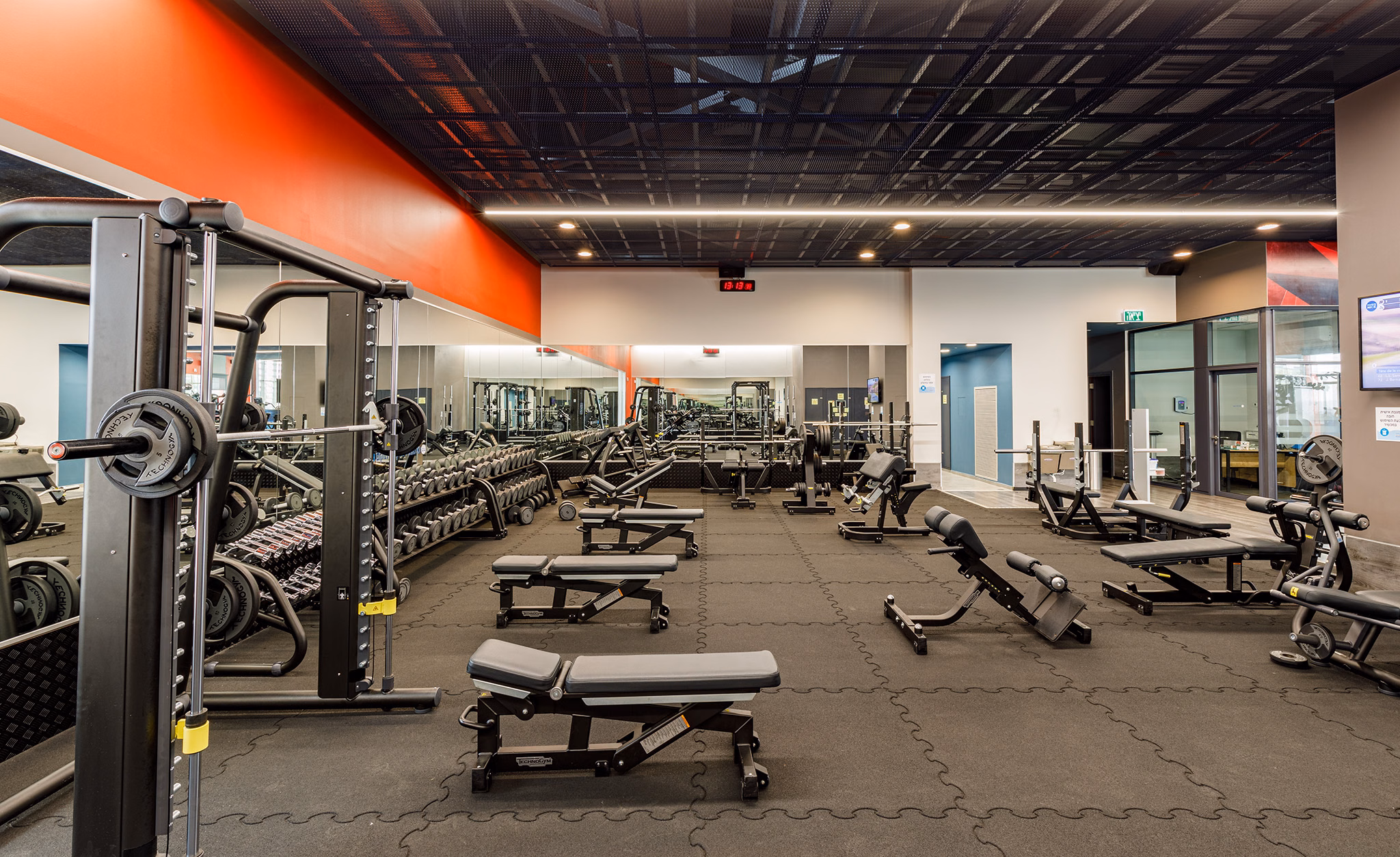 Strength-training equipment and benches at Barbur Community Center in Tel Aviv, Israel