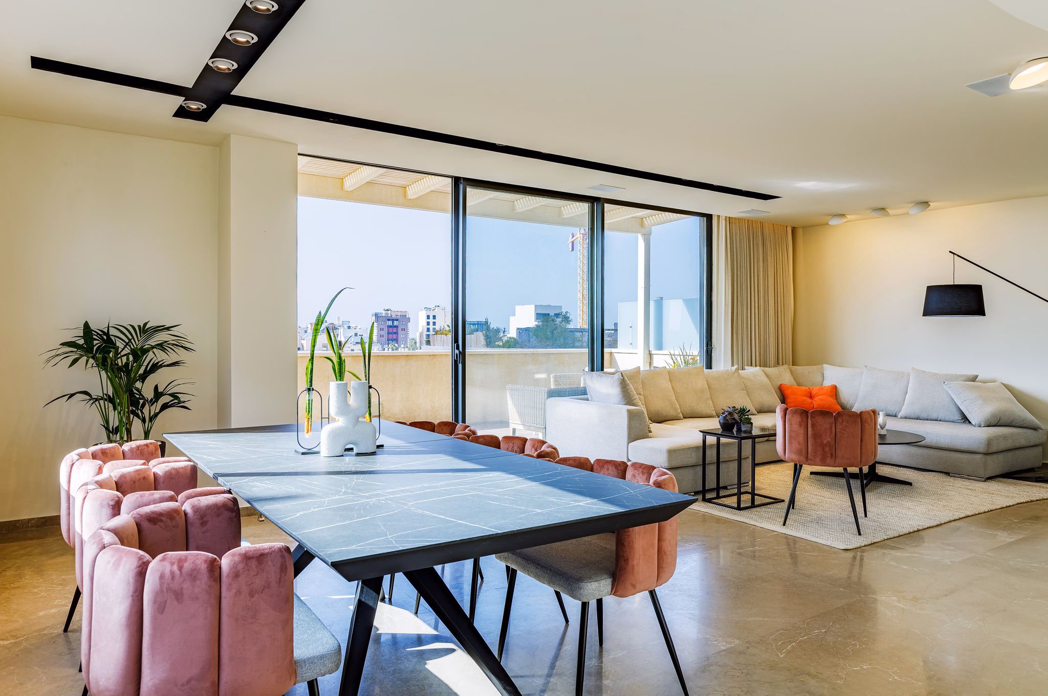 Living and dining room with city terrace at Dizengoff Duplex in Tel Aviv, Israel