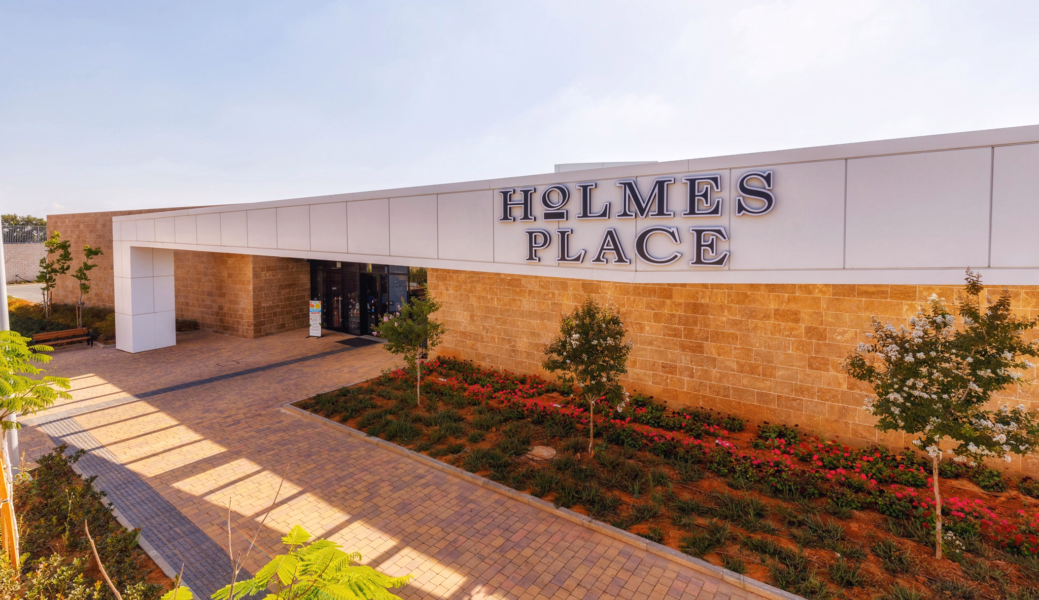 Fitness-club entrance facade and signage at Holmes Place Kfar Saba in Kfar Saba, Israel