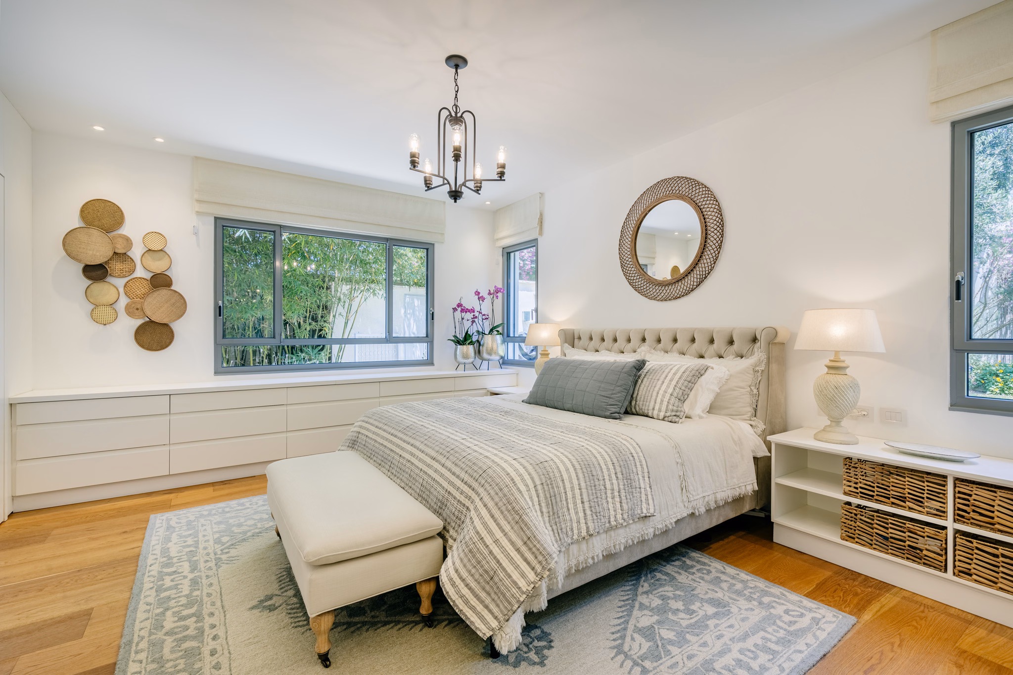 Main bedroom with upholstered bed at Villa Hod HaSharon in Hod HaSharon, Israel